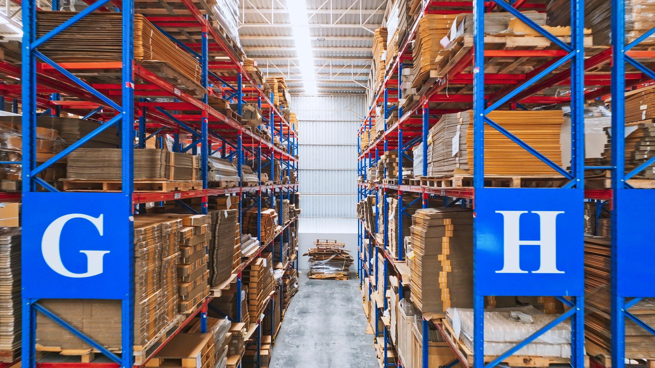 Warehouse shelves stocked with boxed inventory ready to ship